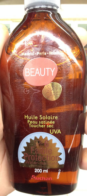Huile solaire peau satinée toucher sec